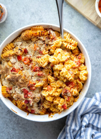 Spicy harissa and flavorful roasted red peppers are the perfect duo of flavors in this rich and cheesy harissa mac and cheese!
