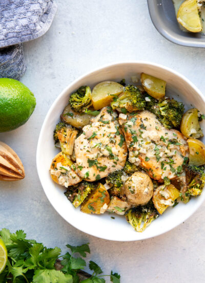 Covered in a creamy cilantro lime sauce and roasted alongside baby potatoes and broccoli, this creamy cilantro lime chicken is an easy sheet pan dinner that's ready in under an hour!