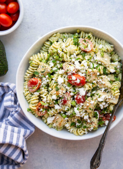 This green goddess pasta salad is packed with juicy grilled chicken, tangy feta, and a flavorful homemade green goddess dressing. It's the best lunch salad and also perfect for any cookout!