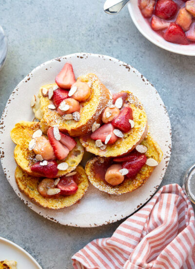 This buttery amaretto french toast has the perfect amount of almond flavor and is amazing topped with a caramelized strawberry banana sauce.