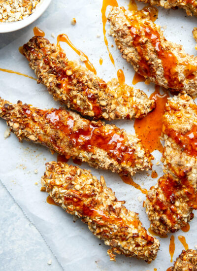 Pretzel crusted chicken tenders are cooked to incredibly crispy perfection in the air fryer and drizzled with an addictive hot honey glaze!
