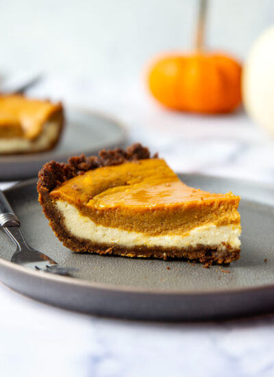 This pumpkin cheesecake pie features silky layers of pumpkin pie filling and rich cheesecake on a spiced gingersnap crust. - a keeper pie for any holiday table!