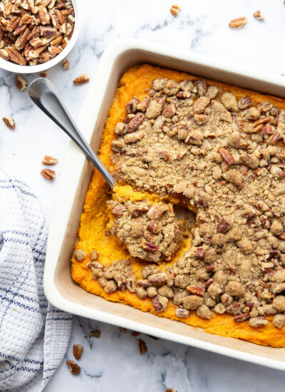 This sweet potato casserole with pecan streusel is a side dish favorite around the holidays and features sweet mashed sweet potatoes baked with a buttery pecan streusel on top.
