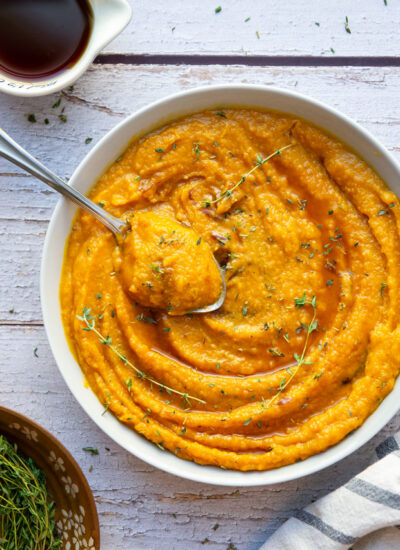 This mashed butternut squash features tender roasted butternut squash mashed with a rich maple butter sauce and topped with lots of fresh thyme. - it's the easiest squash side dish!