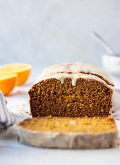 This soft gingerbread loaf cake is packed with the perfect amount of ginger flavor and topped with a sweet orange glaze.