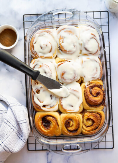 Incredibly soft and melt-in-your-mouth overnight cinnamon rolls with lots of tangy cream cheese frosting AND a time-saving overnight option. These classic cinnamon rolls are the ultimate breakfast indulgence!