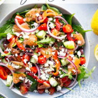 This smoked salmon Greek salad is a twist on the classic and features flavorful smoked salmon with a tangy lemon dill vinaigrette tossed with greens and lots of Greek ingredients.