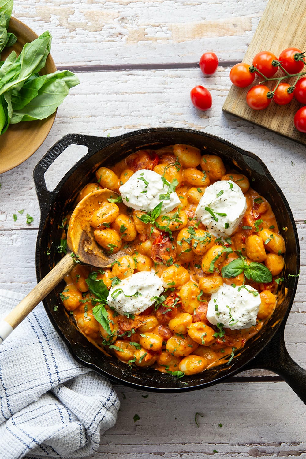 A creamy fresh cherry tomato sauce coats every inch of pillowy gnocchi in this summery burst tomato gnocchi that's topped with lots of fresh basil and rich burrata cheese.