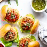 Topped with tender roasted red peppers and a flavorful chimichurri sauce, these cheddar turkey burgers are the perfect summer sandwich.