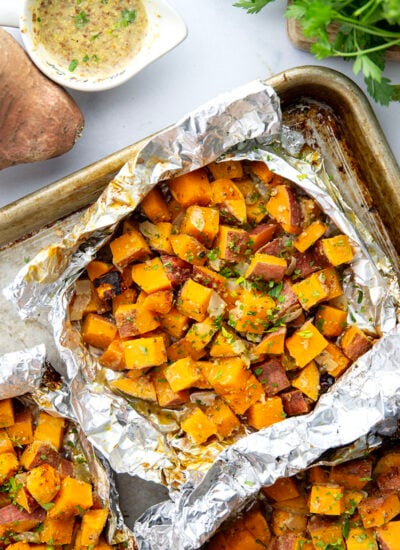 Tossed in a homemade honey mustard and grilled to tender, smoky perfection in foil packets, these grilled sweet potatoes in foil are an easy side dish to throw on the grill for any occasion.