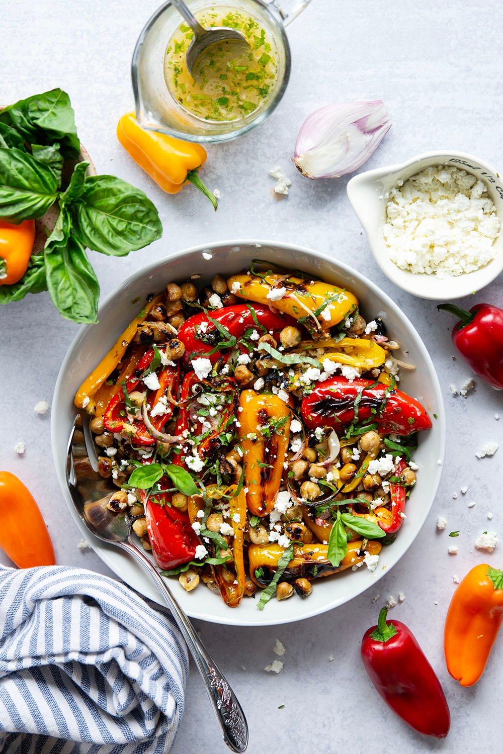 These grilled marinated chickpeas feature tender chickpeas and mini sweet peppers marinated for hours in a fresh lemon herb sauce and grilled until crispy.
