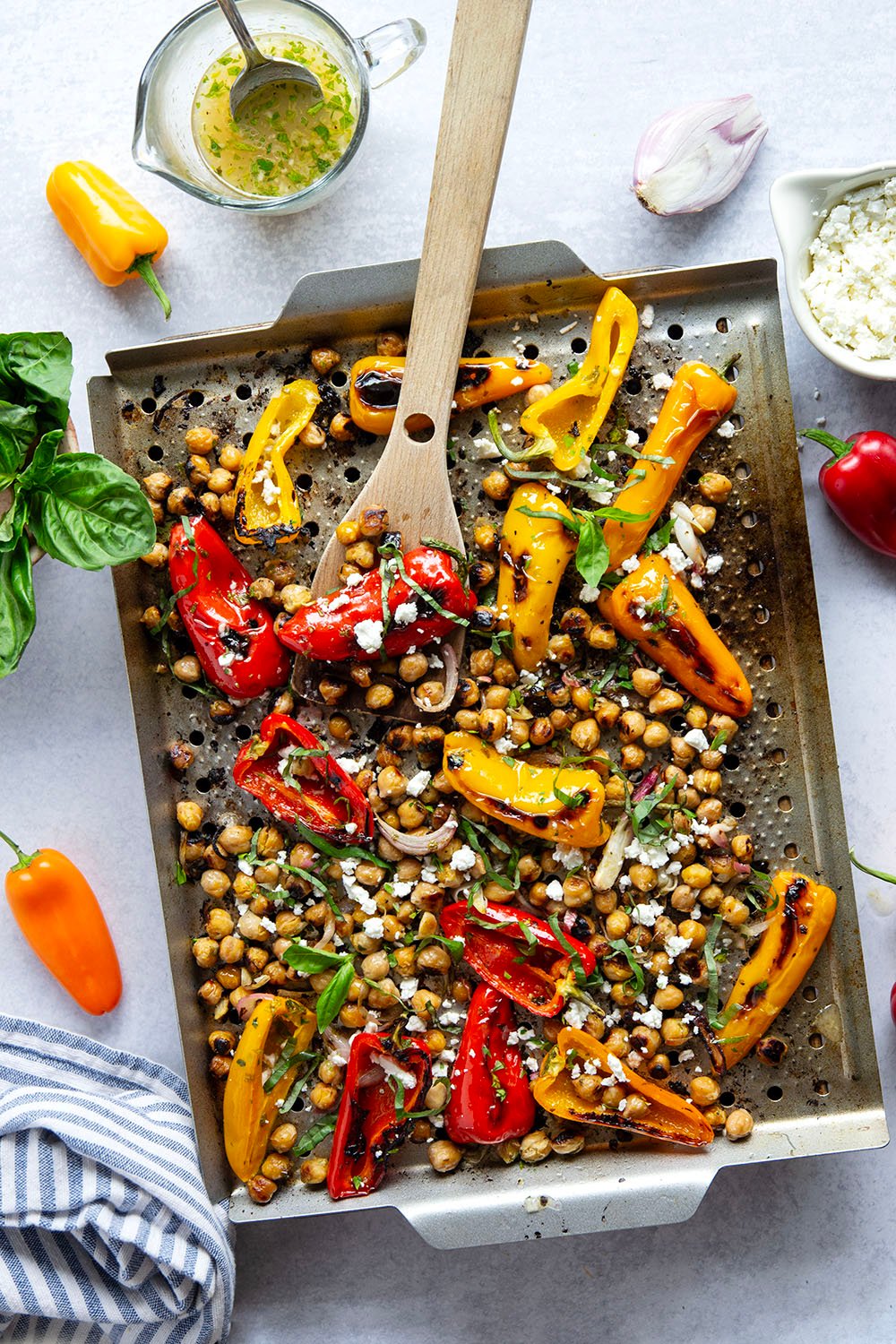 These grilled marinated chickpeas feature tender chickpeas and mini sweet peppers marinated for hours in a fresh lemon herb sauce and grilled until crispy.