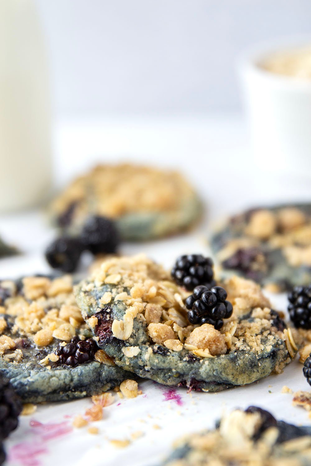 Baked with juicy blackberries inside and topped with a buttery oatmeal streusel, these streusel blackberry cookies are like a blackberry crisp in cookie form!