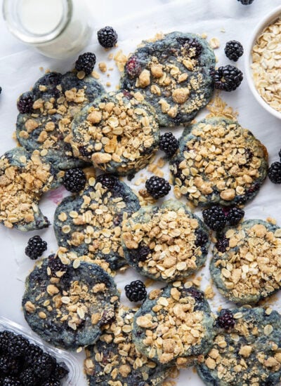 Baked with juicy blackberries inside and topped with a buttery oatmeal streusel, these streusel blackberry cookies are like a blackberry crisp in cookie form!