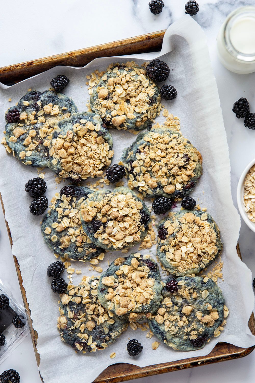 Baked with juicy blackberries inside and topped with a buttery oatmeal streusel, these streusel blackberry cookies are like a blackberry crisp in cookie form!