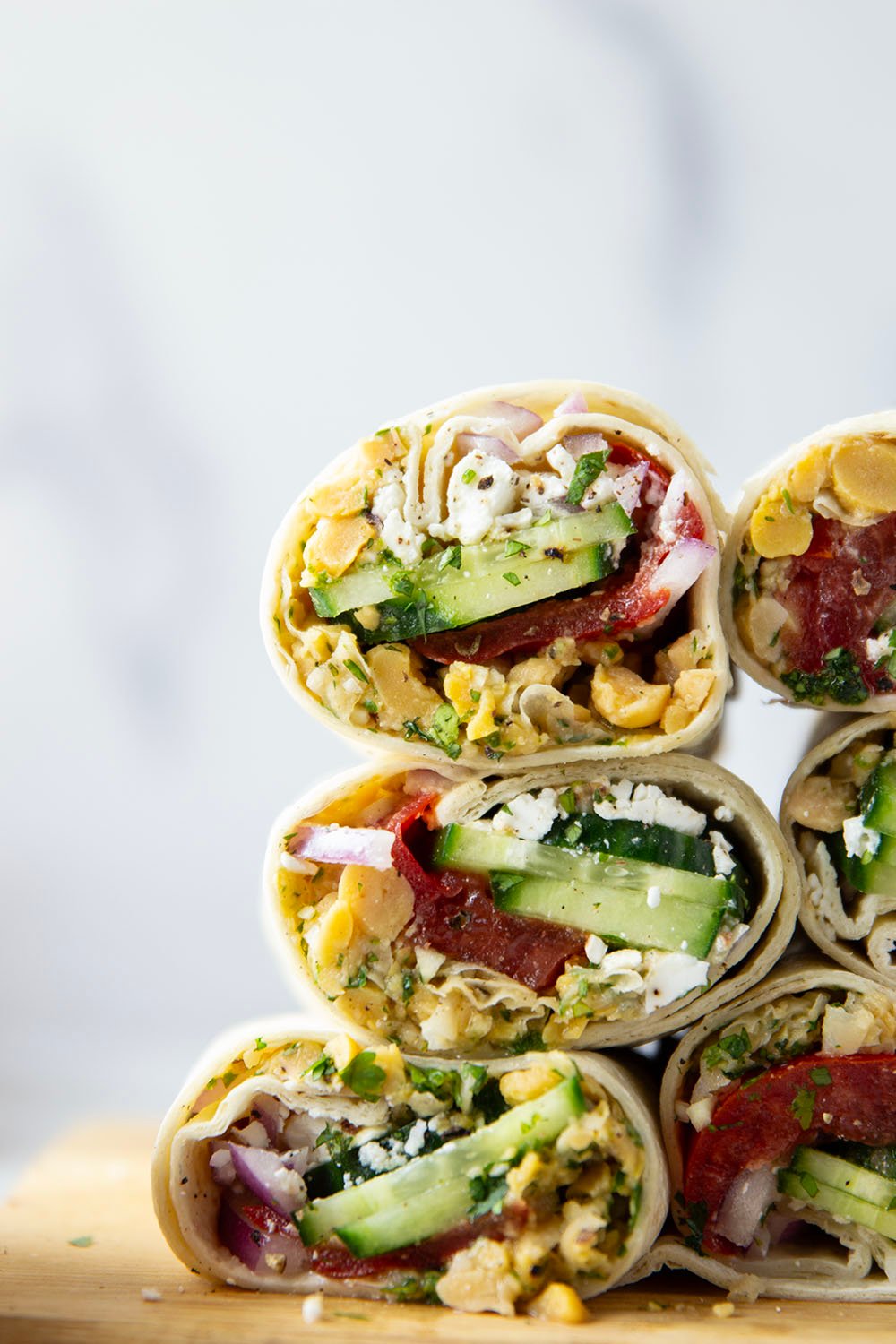 Lemony herb smashed chickpeas and lots of fresh Mediterranean ingredients make for the best lunch in this Mediterranean chickpea wrap.