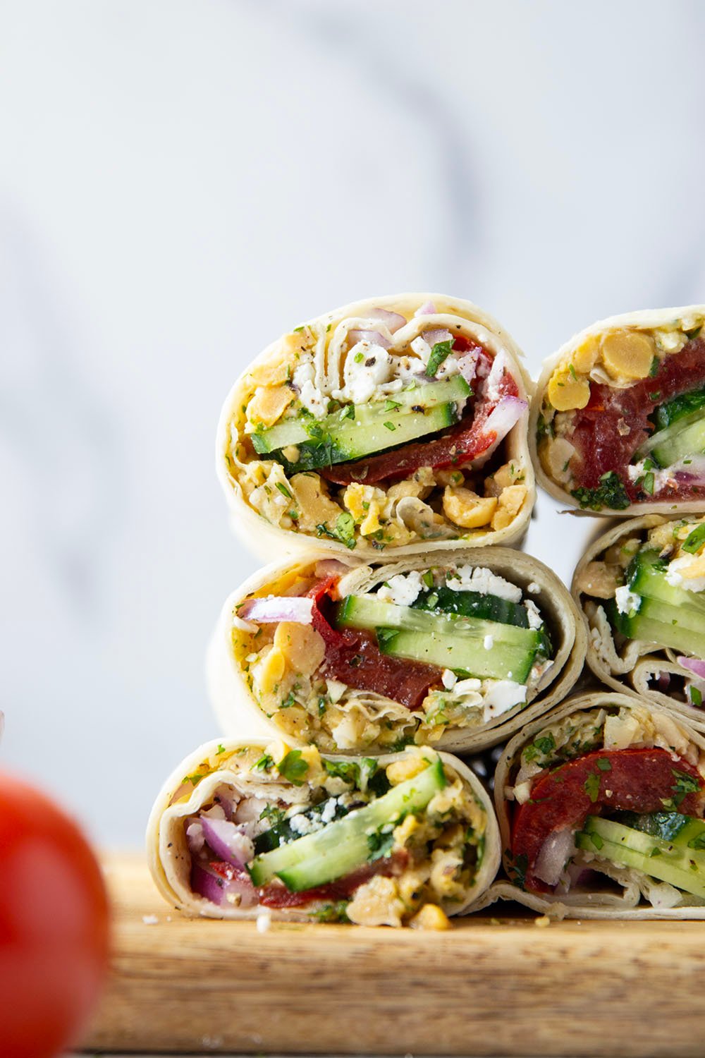 Lemony herb smashed chickpeas and lots of fresh Mediterranean ingredients make for the best lunch in this Mediterranean chickpea wrap.