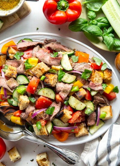 Juicy grilled steak, charred bread cubes, juicy tomatoes, and lots of fresh basil make for the perfect summery meal in this grilled steak panzanella salad.