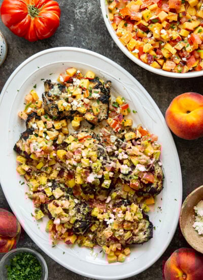 Marinated in a flavorful tahini sauce, grilled to smoky perfection, and topped with a tangy peach feta salsa, this grilled tahini chicken is an explosion of flavors!