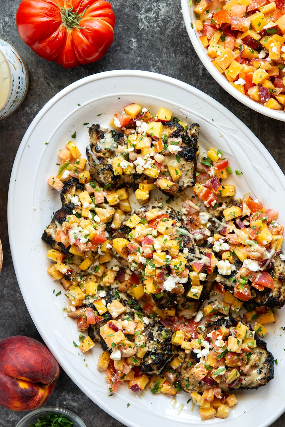 Marinated in a flavorful tahini sauce, grilled to smoky perfection, and topped with a tangy peach feta salsa, this grilled tahini chicken is an explosion of flavors!