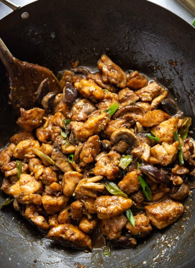 This mushroom chicken stir fry features tender sautéed mushrooms and golden pan-fried chicken cubes tossed in a savory black pepper stir fry sauce.