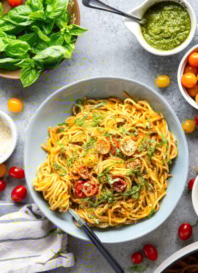 This roasted cherry tomato pasta features pesto-roasted cherry tomatoes pureed until smooth and tossed with tender pasta and lots of fresh basil and Parmesan cheese.