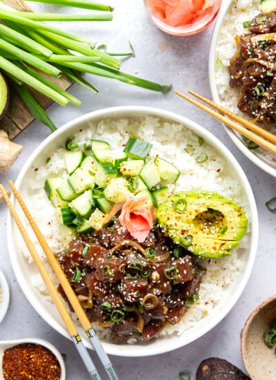 Marinated in a fresh ginger soy sauce and piled into bowls with lots of toppings, these ahi tuna poke bowls are quick to prep and better than any restaurant!