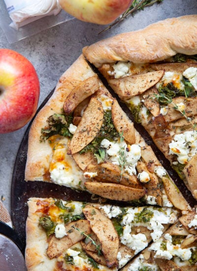 Tangy goat cheese, tender apples, and crispy kale leaves are the perfect fall trio of flavors in this apple goat cheese pizza.
