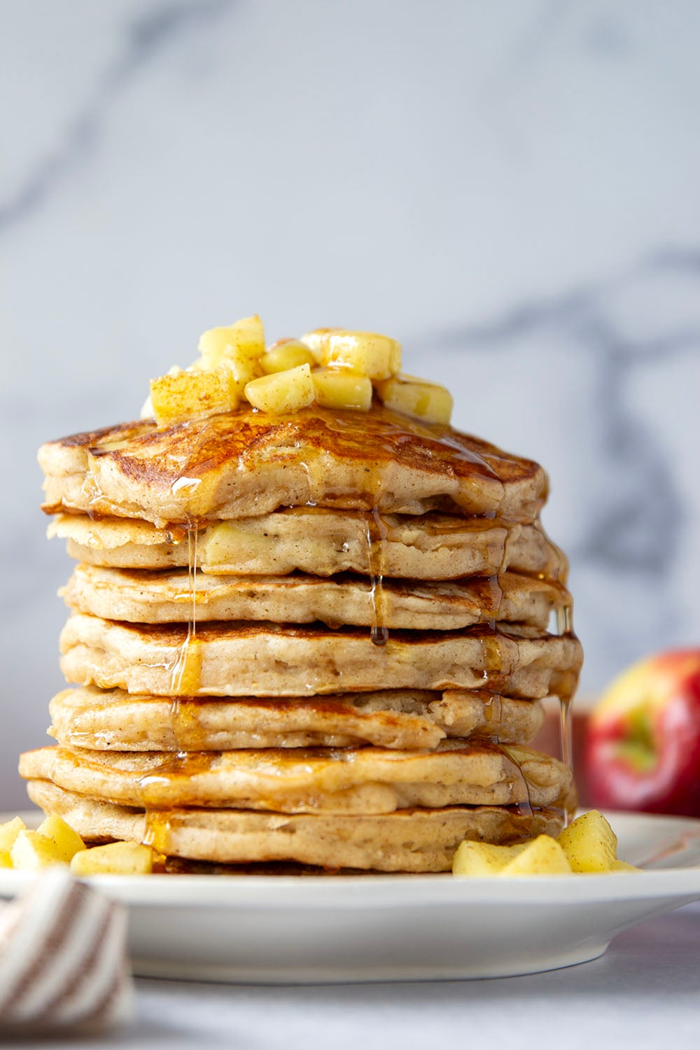 These apple ricotta pancakes are the ultimate fall breakfast! Ricotta cheese gives them an incredible light and fluffy texture while sautéed apples and lots of spices give them the perfect touch of fall.