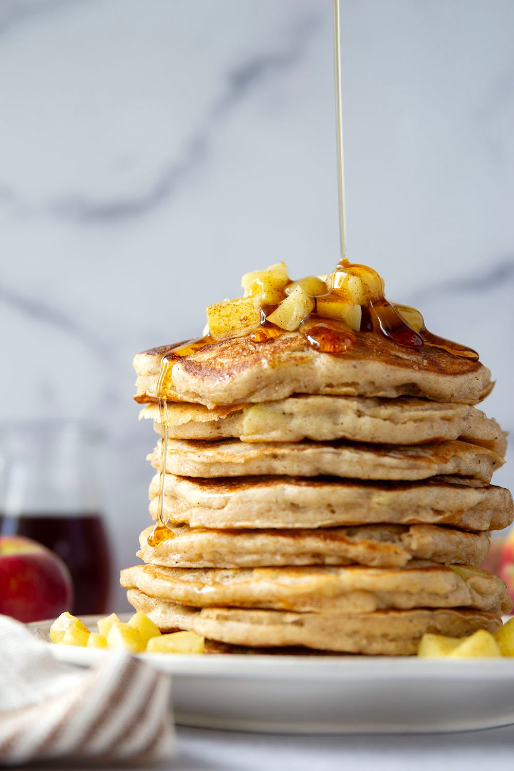 These apple ricotta pancakes are the ultimate fall breakfast! Ricotta cheese gives them an incredible light and fluffy texture while sautéed apples and lots of spices give them the perfect touch of fall.