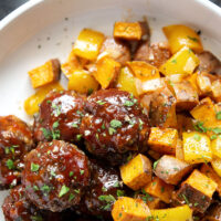 Baked in minutes on only one sheet pan, these honey BBQ meatballs are coated in a sweet and tangy homemade honey BBQ sauce and roasted alongside tender sweet potatoes.