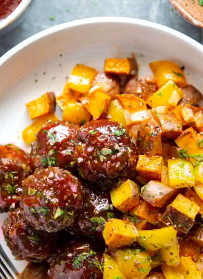 Baked in minutes on only one sheet pan, these honey BBQ meatballs are coated in a sweet and tangy homemade honey BBQ sauce and roasted alongside tender sweet potatoes.