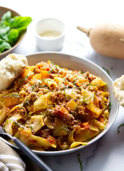 This turkey bolognese features tender butternut squash and ground turkey in a rich sauce simmered slowly for lots of flavor and tossed with tender pappardelle pasta.