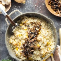 Rich and creamy butternut squash risotto is cooked with plenty of tender butternut squash cubes and nutty asiago cheese and served with crispy fried mushrooms on top.