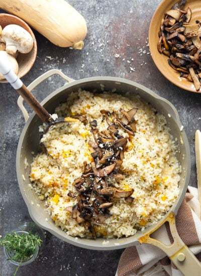Rich and creamy butternut squash risotto is cooked with plenty of tender butternut squash cubes and nutty asiago cheese and served with crispy fried mushrooms on top.