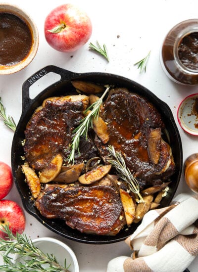 Baked alongside tender apples and glazed in a sweet apple butter sauce, these apple butter pork chops are a quick weeknight fall dinner that comes together in minutes.
