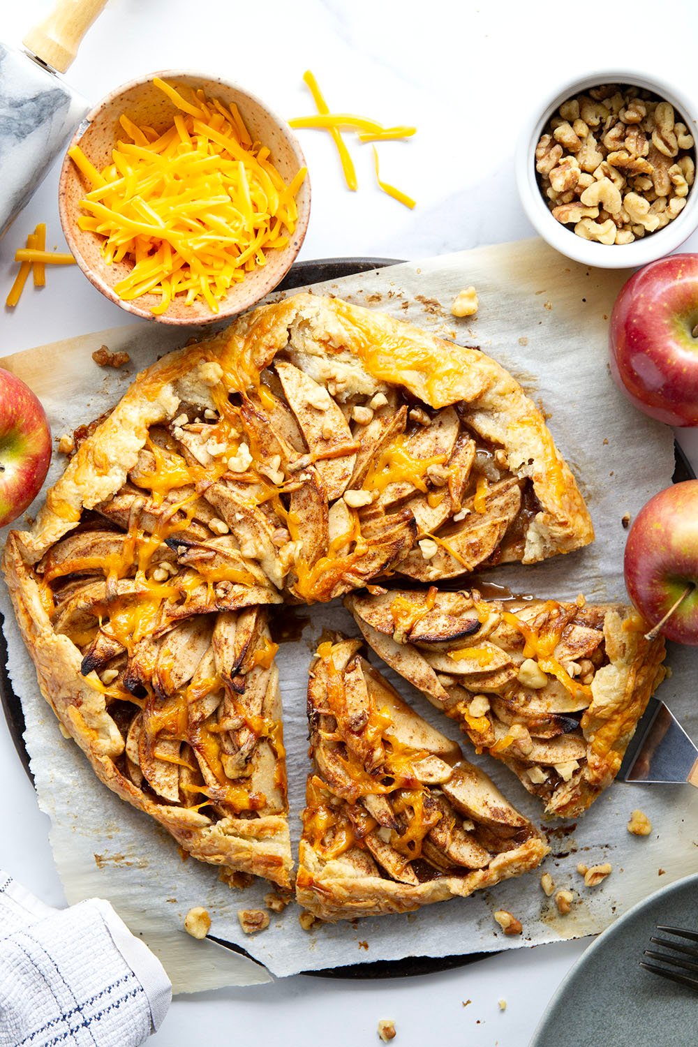 Baked with cheddar cheese in both the flaky crust and tender apple filling, this cheddar apple galette is a simple free-form pastry that's the perfect mix of sweet and savory!