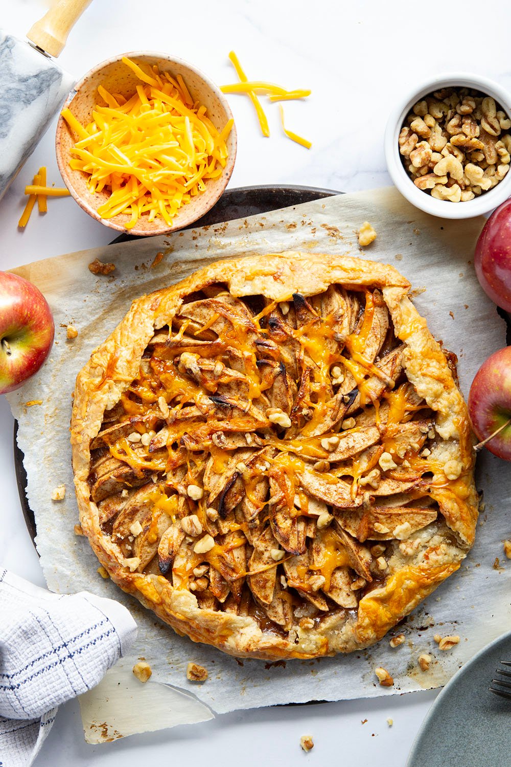 Baked with cheddar cheese in both the flaky crust and tender apple filling, this cheddar apple galette is a simple free-form pastry that's the perfect mix of sweet and savory!