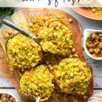 This couscous stuffed acorn squash features fluffy Moroccan-spiced golden couscous piled into tender acorn squash boats.