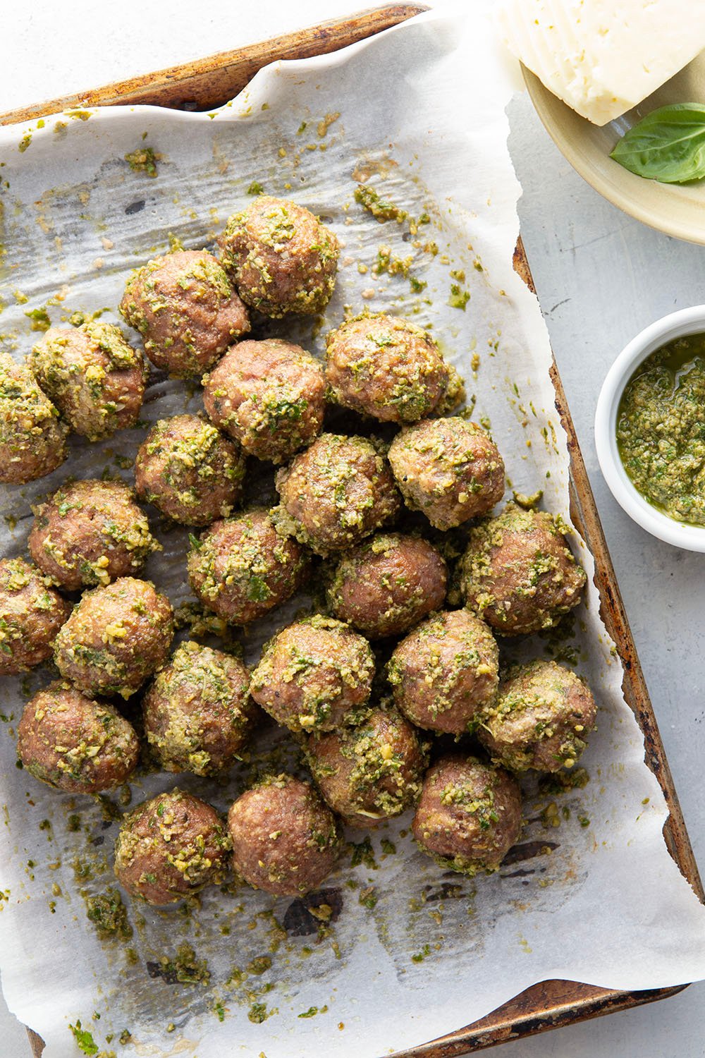 Juicy turkey meatballs are tossed in flavorful basil pesto and baked with lots of gooey havarti cheese in this pesto meatball sandwich.