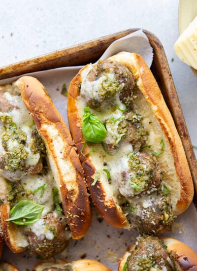 Juicy turkey meatballs are tossed in flavorful basil pesto and baked with lots of gooey havarti cheese in this pesto meatball sandwich.