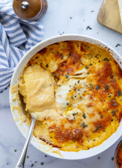 Baked in a creamy pumpkin sauce with lots of cheese and crispy sage on top, this baked pumpkin ravioli is an easy fall side dish that's ready in minutes.