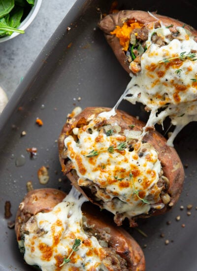 These mushroom sausage stuffed sweet potatoes feature a flavorful Italian sausage mushroom filling stuffed into fluffy baked sweet potatoes and baked with lots of gooey mozzarella on top.