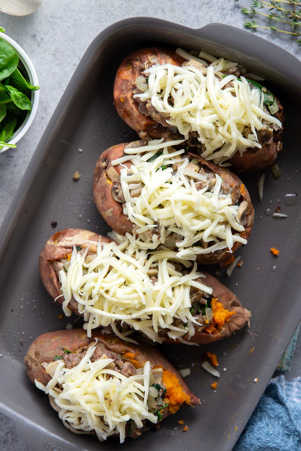 These mushroom sausage stuffed sweet potatoes feature a flavorful Italian sausage mushroom filling stuffed into fluffy baked sweet potatoes and baked with lots of gooey mozzarella on top.