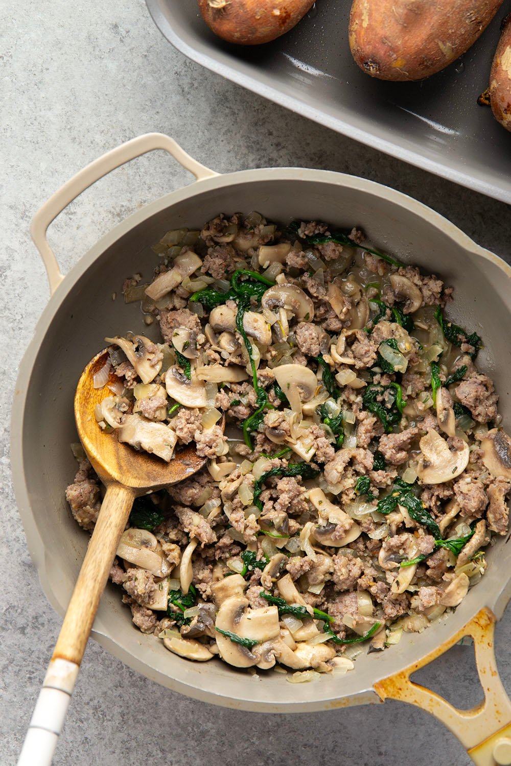 These mushroom sausage stuffed sweet potatoes feature a flavorful Italian sausage mushroom filling stuffed into fluffy baked sweet potatoes and baked with lots of gooey mozzarella on top.