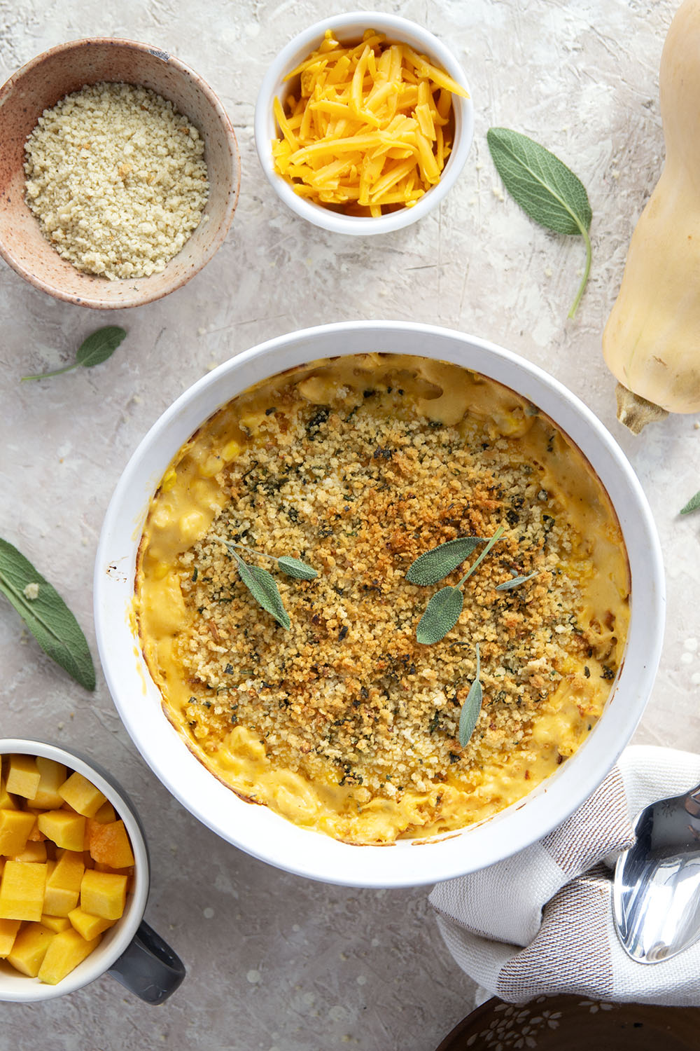 Creamy roasted butternut squash adds an amazing silky texture to this butternut squash creamed corn that gets topped with crispy sage breadcrumbs.