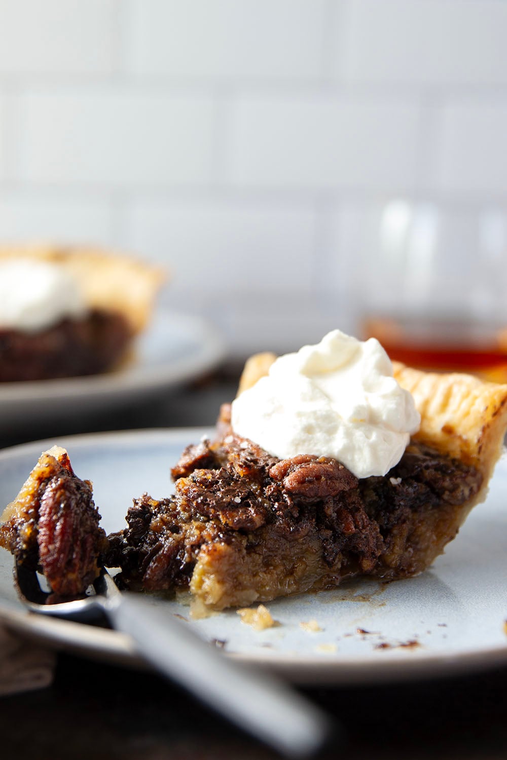 Rich dark chocolate and smooth bourbon are a dream pairing in this gooey dark chocolate bourbon pecan pie that's perfect for the holidays.
