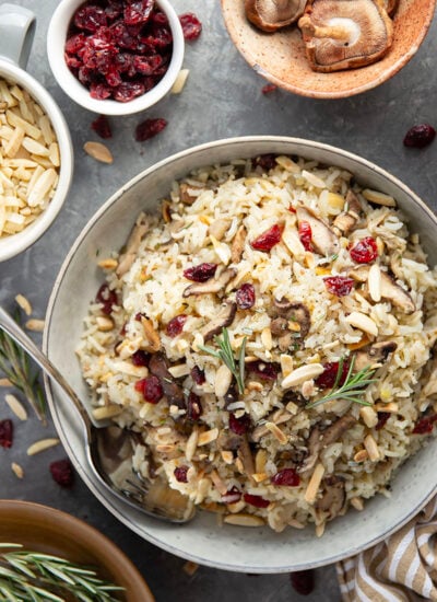 This wild mushroom rice pilaf features lots of tender sauteed wild mushrooms, sweet dried cranberries, and crunchy toasted almonds cooked in minutes on the stovetop.