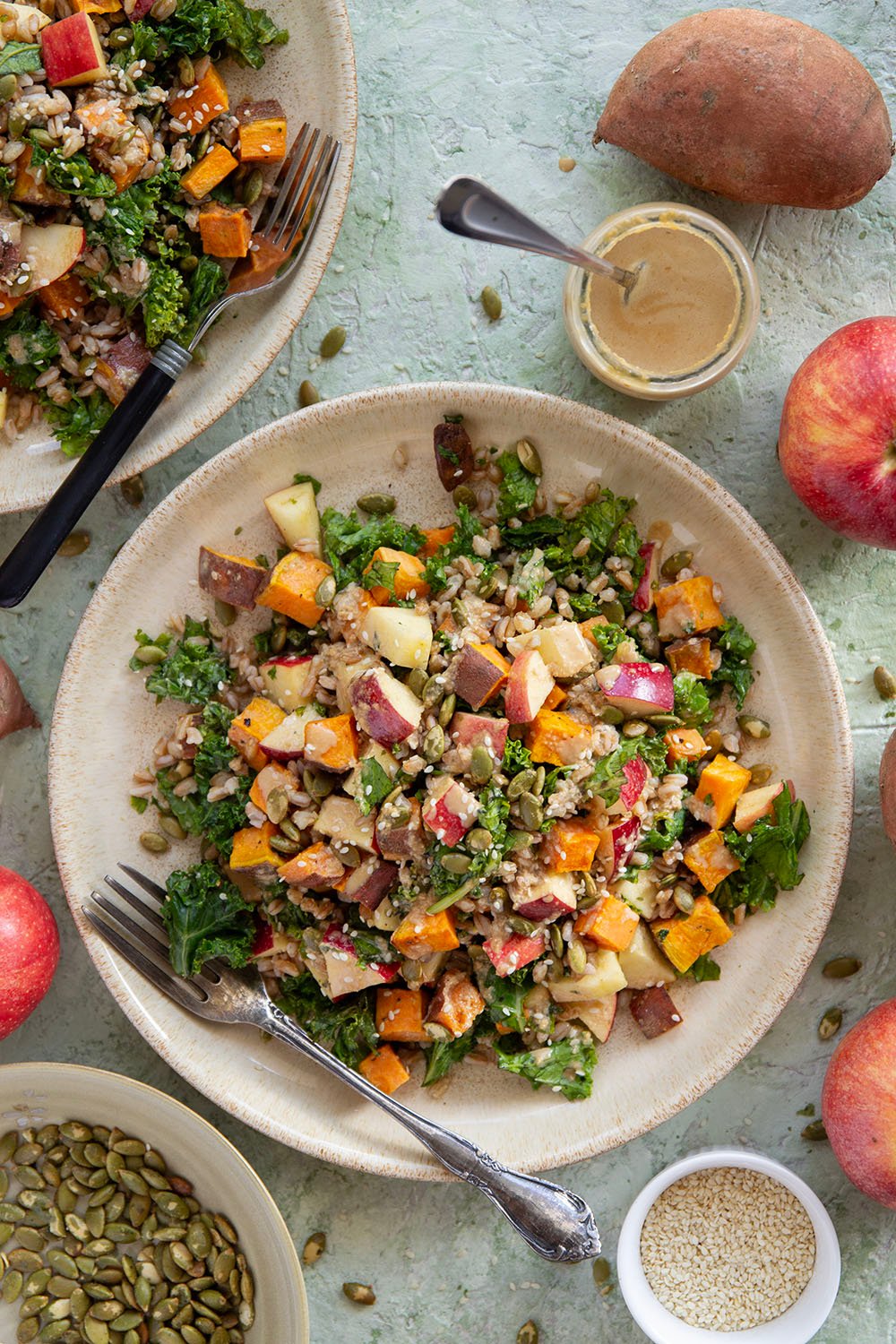 Tender roasted sweet potatoes and hearty farro add plenty of bulk to this fall-flavored sweet potato farro salad that gets dressed with a savory sesame dressing.
