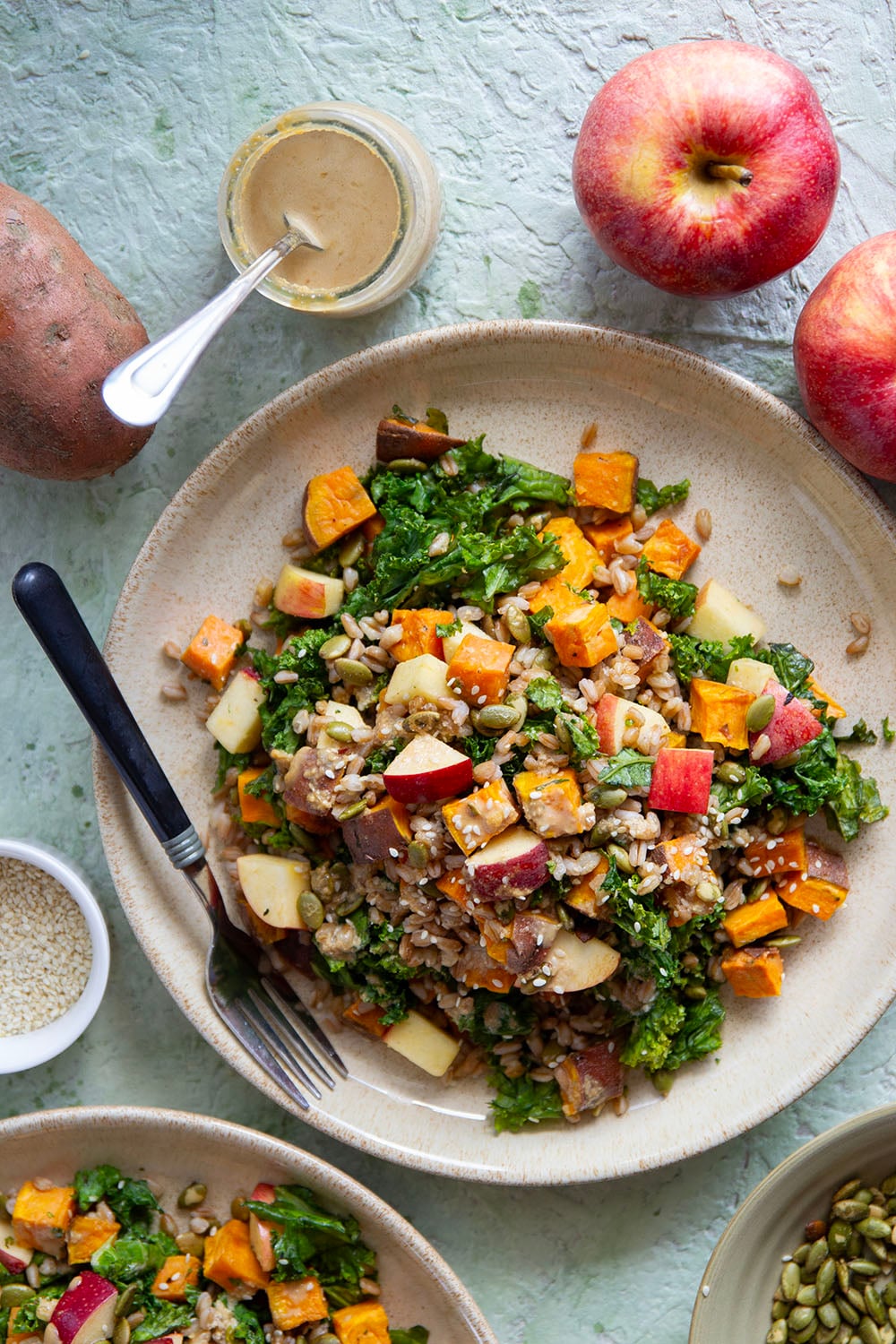 Tender roasted sweet potatoes and hearty farro add plenty of bulk to this fall-flavored sweet potato farro salad that gets dressed with a savory sesame dressing.